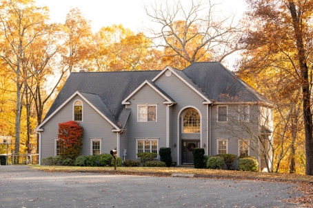 fall leaves surrounding a house